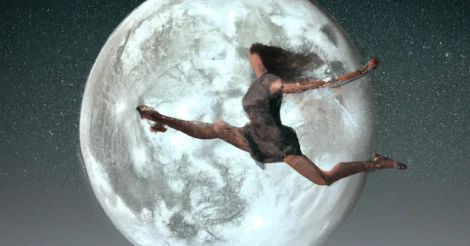 A woman jumping down onto the moon from earth, by DALL-E.